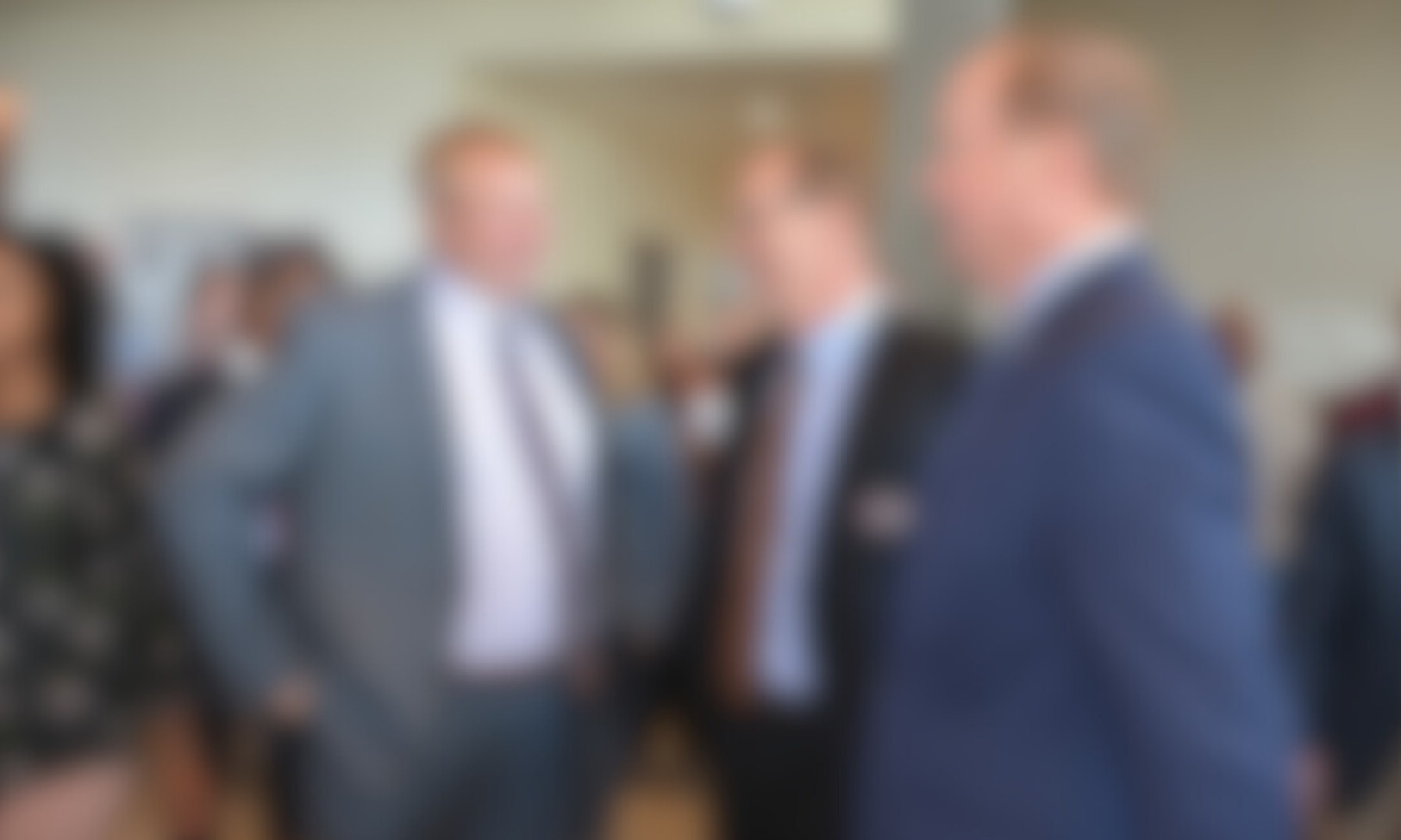 blurred men in suits